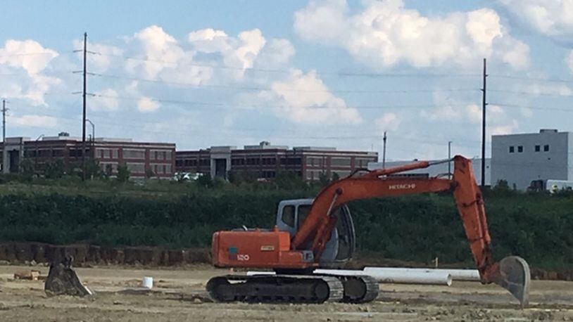 A new Austin Business Park building in Miamisburg will be the next home of Winter Guard International, officials said recently. The organization, which hosts world events in the Dayton region, will occupy about 20 percent of the 60,000 square foot facility. It will be located near the Interstate 75/Austin Boulevard interchange. Buildings in the background include United Grindings North America headquarters (white) and offices at Austin Landing. NICK BLIZZARD/STAFF
