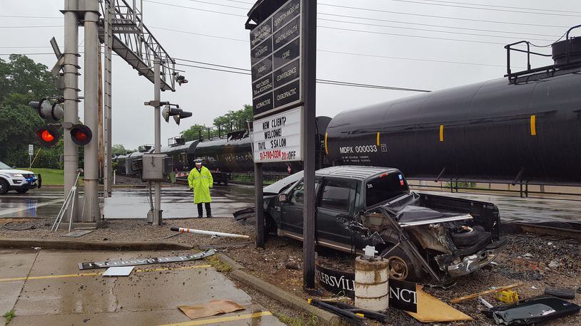 A truck slid on rain slicked roads and into a railroad crossing this morning near the intersection of Tylersville and Cincinnati Dayton roads. CONTRIBUTED