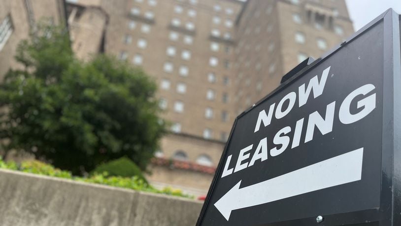 A "now leasing" sign outside of an apartment building in downtown Dayton. CORNELIUS FROLIK / STAFF