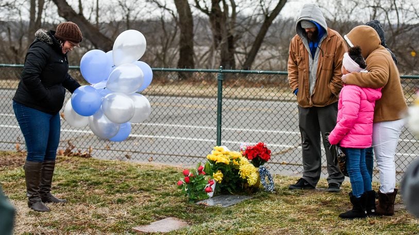 Rebecca Sandle left, the mother of CJ Sandle, gathered with friends for a balloon launch on what would have been CJ’s 21st birthday last year. This year she is once asking people to mark the day with a random act of kindness. NICK GRAHAM/STAFF