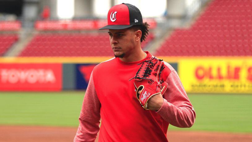 Reds pitcher Luis Castillo leaves the field after batting practice on Opening Day on Friday, March 30, 2018, at Great American Ball Park in Cincinnati. David Jablonski/Staff