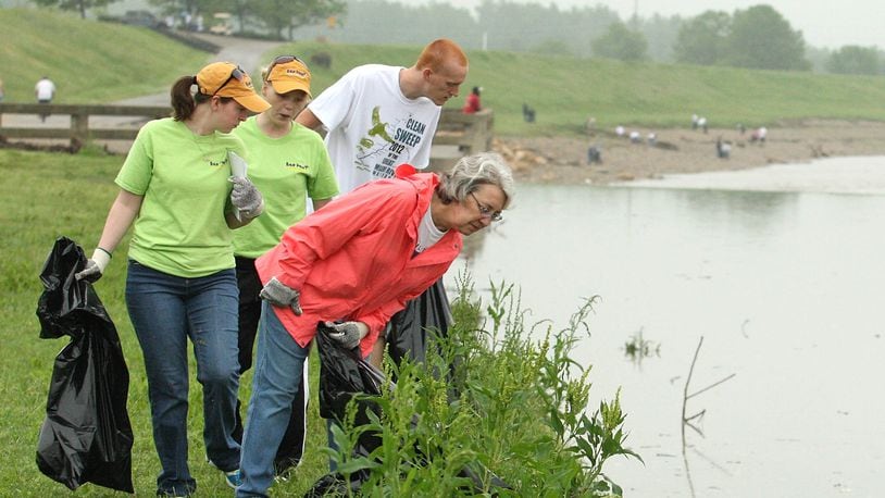 Volunteers look for litter while participating in a previous Clean Sweep of the Great Miami River.