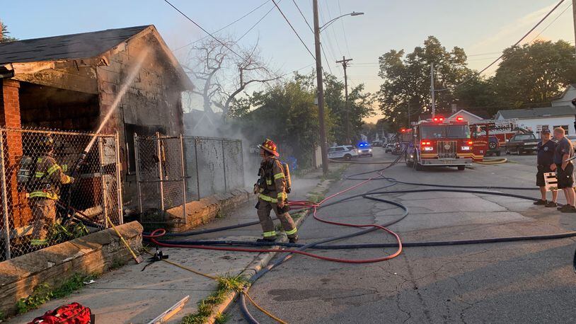 A woman was trapped inside this burning Middletown residence on July 26 and she was carried to safety by two Middletown police officers. MIDDLETOWN DIVISION OF FIRE