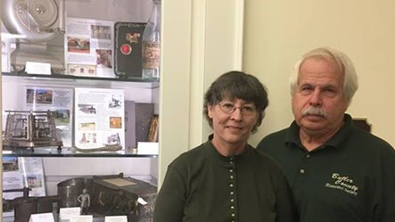 The Butler County Historical Society (BCHS) was invited to create a special exhibit to highlight the county’s history and attractions for the Thomas Worthington Center at the Ohio Statehouse, 1 Capitol Square, Columbus. Pictured, from left, Kathy Creighton, Butler County Historical Society Executive Director and volunteer Ed Creighton. CONTRIBUTED
