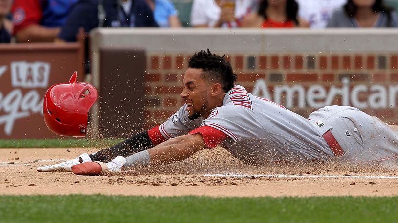 CHICAGO, IL - JULY 5:  Billy Hamilton #6 of the Cincinnati Reds slides into home plate to score a run in the first inning against the Chicago Cubs at Wrigley Field on July 5, 2016 in Chicago, Illinois. (Photo by Dylan Buell/Getty Images)