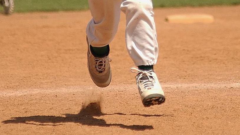 Stock photo of a young baseball player running the bases. (Photo credit: KeithJJ / Pixabay.com)