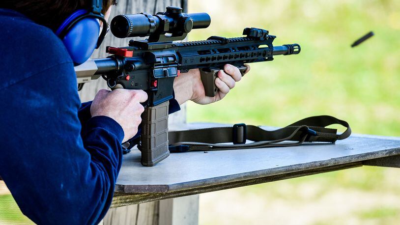 A patron fires an AR-15 style rifle at Lake Bailee recreational park and gun range Tuesday, May 1 in St. Clair Township. NICK GRAHAM/STAFF