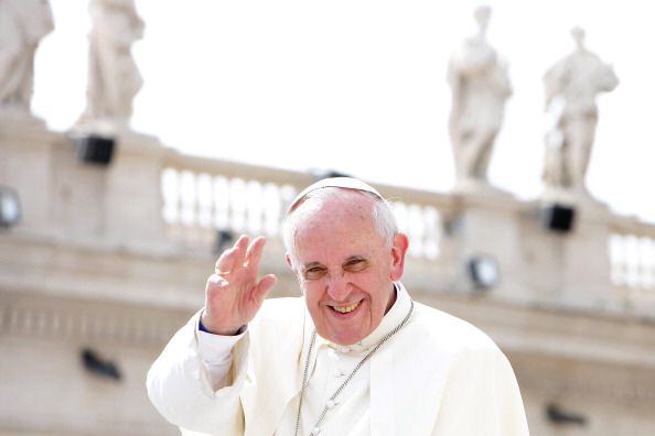 Pope Francis waves to the faithful at the end of his weekly General Audience in St. Peter's Square (September 11, 2013)