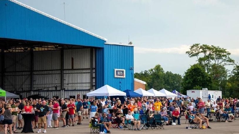 People attend "Hops in the Hangar", a beer event at the Middletown Regional Airport. CONTRIBUTED