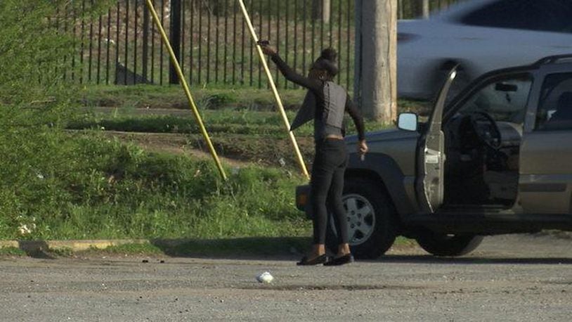 A woman police identified as Freddrica Blair points a gun in the parking lot of a Memphis church.