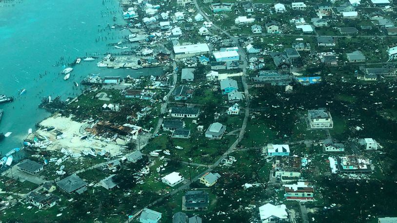 This aerial photo provided by Medic Corps, shows the destruction brought by Hurricane Dorian on Man-o-War cay, Bahamas, Tuesday, Sept.3, 2019. Multiple cruise line companies have pledged to help the region recover from the storm.