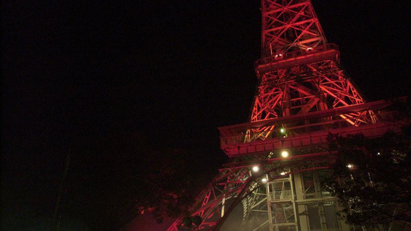 The Eiffel Tower is lit a blood red at Kings Island’s Halloween Haunt. STAFF FILE PHOTO