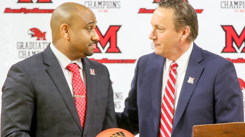 Jack Owens, the new Miami University head basketball coach, is introduced by David Sayler, Miami University Athletic Director, during a public event at Millett Hall in Oxford, Thursday, Mar. 30, 2017. GREG LYNCH / STAFF