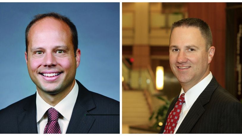 Dr. Keith Bricking (left) will succeed Mike Uhl (right) as president of Atrium Medical Center on Jan. 1. He is the first physician to lead a Premier Health hospital in the system’s 23-year history. CONTRIBUTED