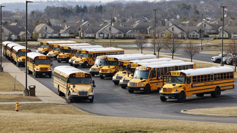 School buses are seen waiting to transport students at the Hamilton High School Freshman Campus on the city's west side around 2:30 p.m. Wed., Feb. 8, 2023. NICK GRAHAM/STAFF