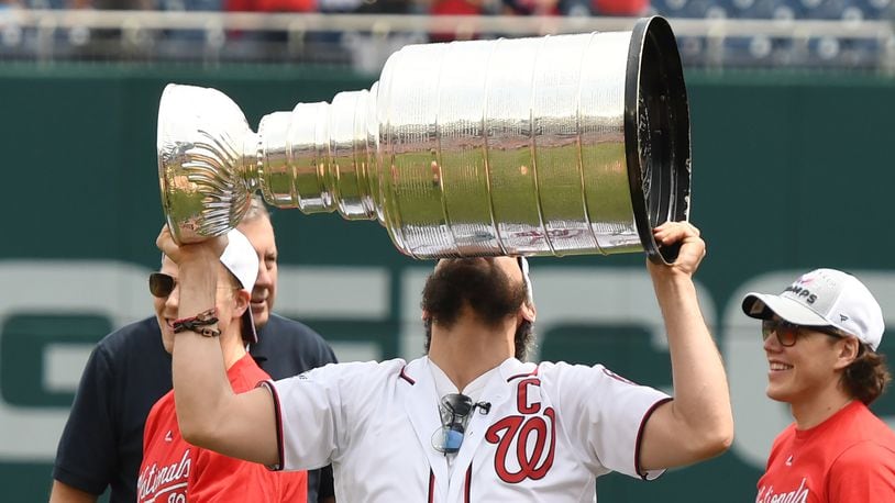 WASHINGTON, DC - JUNE 09:  Alex Ovechkin of the Washington Capitals raises the Stanley Cup as the team is honored before a baseball game between the Washington Nationals and the San Francisco Giants at Nationals Park on June 9, 2018 in Washington, DC.  (Photo by Mitchell Layton/Getty Images)