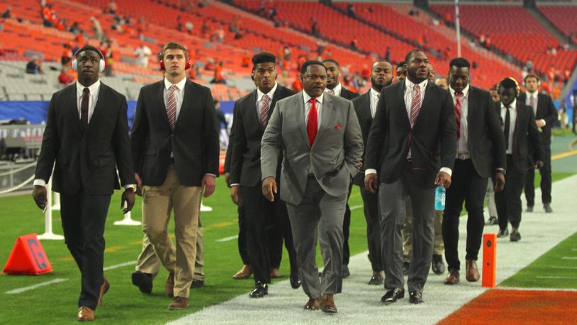 Ohio State defensive line coach Larry Johnson leads his group on a lap around the field before the Fiesta Bowl on Dec. 31, 2016, at University of Phoenix Stadium in Glendale, Ariz. David Jablonski/Staff