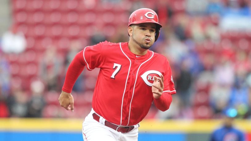 The Reds' Eugenio Suarez runs to third base during a game against the Cubs on Monday, April 2, 2018, at Great American Ball Park in Cincinnati.