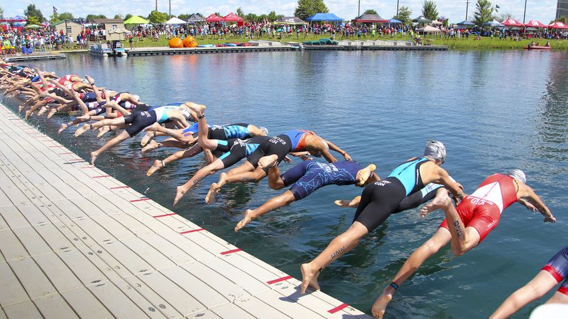 In this 2015 file photo, athletes compete in the USA Triathlon Youth and Junior National Championship at Voice of America MetroPark in West Chester Twp. Parts of Cox Road and Liberty Way, as well as VOA Park, will be closed Saturday and Sunday, Aug. 5-6, to accommodate the event. GREG LYNCH/2015