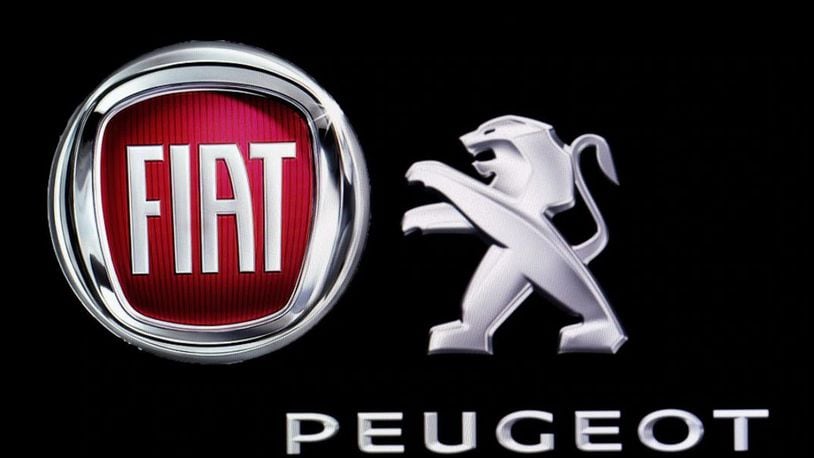 The logos of Fiat Automobiles and Peugeot sit on display in Ankara, Turkey on November 26, 2019.