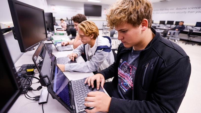 Junior Carson Derickson works on a project in his cyber security 2 class at Lakota East High School Thursday, Oct. 13, 2022 in Liberty Township. Lakota East and West have a Cyber Academy program for students to learn about cyber security. NICK GRAHAM/STAFF