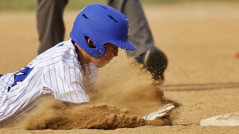 Hamilton’s Cole Vowell is called out at second base after sliding in head first during Hamilton West Side Little League's 10-1 win over Loveland in District 9 Little League championship Monday, July 11, 2022 at Home of the Brave Park in Loveland. NICK GRAHAM/STAFF