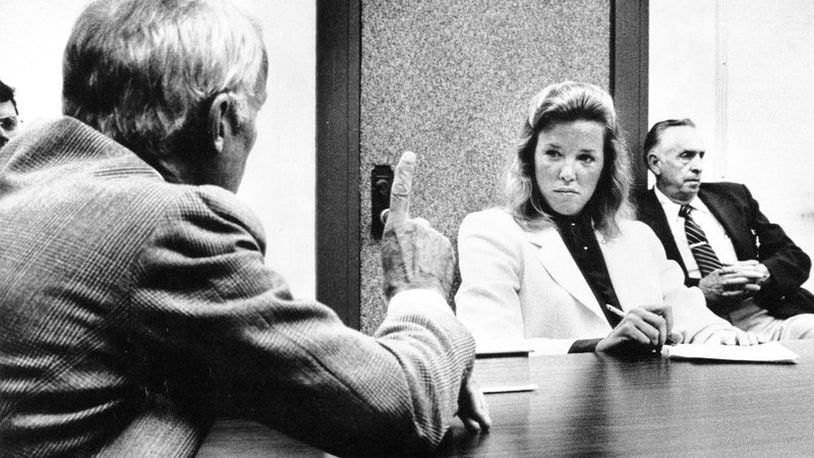 Roxanne Pulitzer listens to her husband Peter testify during their divorce proceedings. in 1982