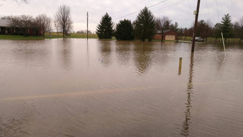 Water covers Millikin Road between Cincinnati-Dayton Road and Yankee Road in Liberty Twp. on Wednesday, March 1. This is a common problem area during heavy rain. NICK GRAHAM/STAFF