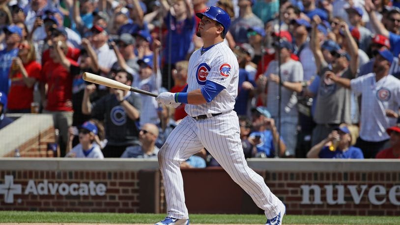 Kyle Schwarber, of the Chicago Cubs, follows the flight of his grand slam home run in the 7th inning against the St. Louis Cardinals at Wrigley Field on June 3, 2017. His contact was non-tendered and he signed a $10 million, one-year deal with the Washington Nationals (Photo by Jonathan Daniel/Getty Images)