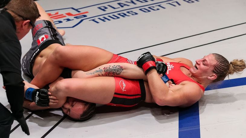 Kayla Harrison, from Middletown, uses her signature armbar move to defeat late-notice replacement Bobbi Jo Dalziel (5-2) in less than four minutes with a submission win Friday night in Las Vegas. PHOTO BY RYAN LOCO/PTL