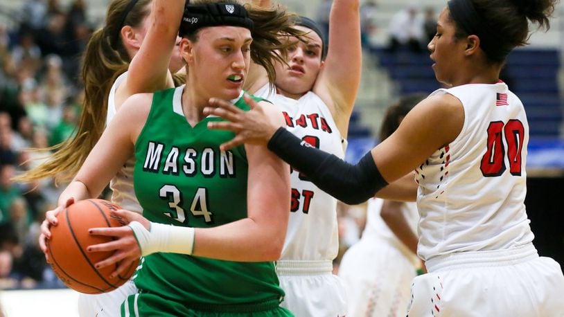 Mason forward Lauren Van Kleunen (34) is surrounded by Lakota West defenders, including Lexi Wasan (middle) and Danielle Wells (00), during their Division I regional final at Fairmont’s Trent Arena on March 5, 2016. Mason won 49-30. GREG LYNCH/STAFF