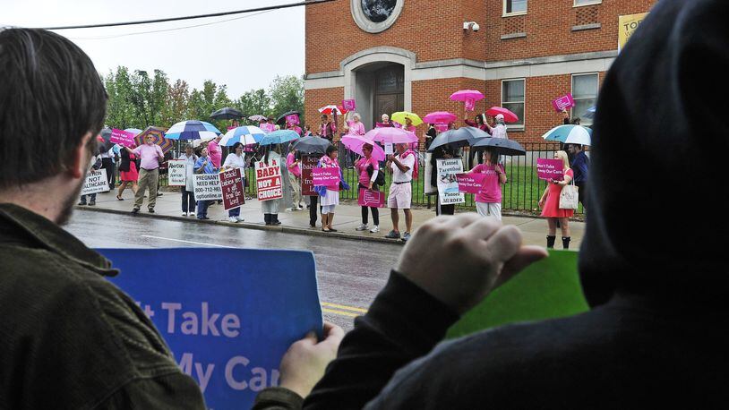 Rallies and vigils were held at Planned Parenthood facilities across the country Saturday to oppose tax dollars given to Planned Parenthood. In Cincinnati protestors turned out at the Planned Parenthood building on Auburn Avenue just like they did last September (shown here) for a protest. NICK GRAHAM/STAFF