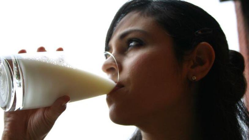 Woman drinking milk (stock photo). (Photo credit: Adrian Becerra / Freeimages.com)