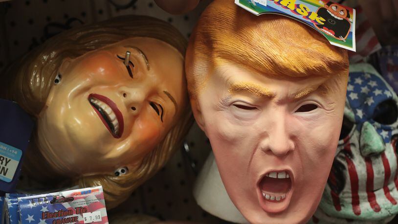 CHICAGO, IL - OCTOBER 19: Masks depicting Republican presidential nominee Donald Trump and Democratic presidential nominee Hillary Clinton are offered for sale at Fantasy Costumes on October 19, 2016 in Chicago, Illinois. (Photo by Scott Olson/Getty Images)