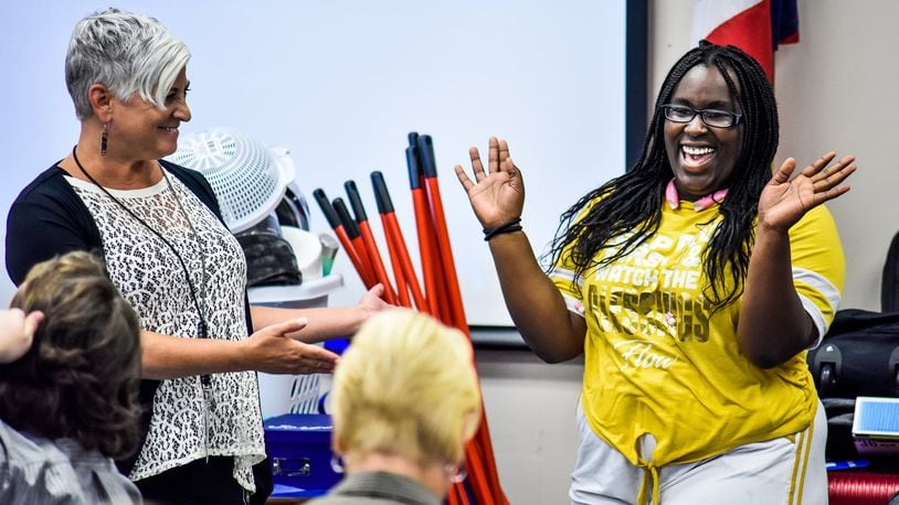 Nakia Woods, right, stands with her coordinator Lori Woodrum during the annual Butler County Children Services graduation celebration is Thursday, June 20 in Hamilton. Woods was a Lakota East student and is working with Proctor & Gamble through Project Reach. NICK GRAHAM/STAFF