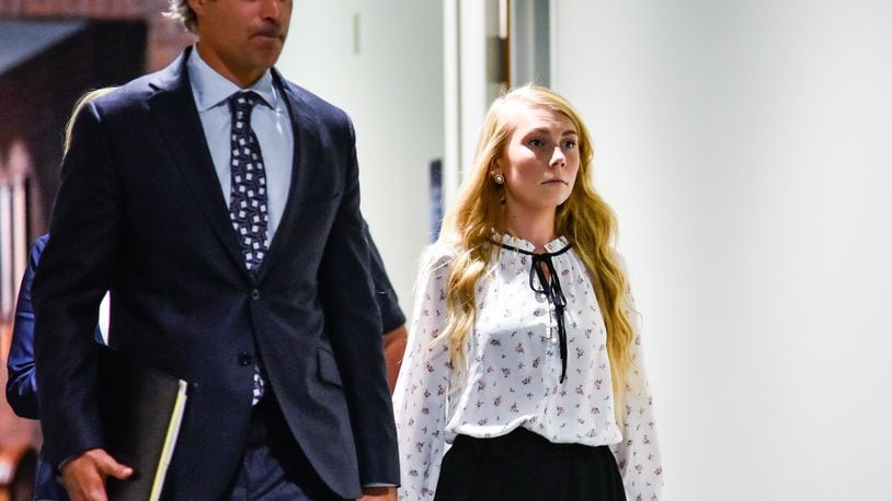 Brooke Skylar Richardson, right, charged with murder for the death of her baby then burying her in the back yard of her Carlisle home, walks with defense attorney Charles M. Rittgers before appearing for a pre-trial hearing in Warren County Common Pleas Court Monday, July 1 in Lebanon. NICK GRAHAM/STAFF