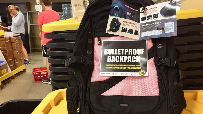 School backpacks are coming under the increasingly focus of security concerns. Hamilton Schools has a new, stricter policy on students’ book bags for the coming school year. And in West Chester Township, an office supply store was offering a bullet-proof backpack for sale. The backpacks are just a part of an increasing security awareness adopted by school districts locally and nationally in the wake of shooting massacres this past school year at Florida and Texas high schools.(Photo by Michael D. Clark/Journal-News)