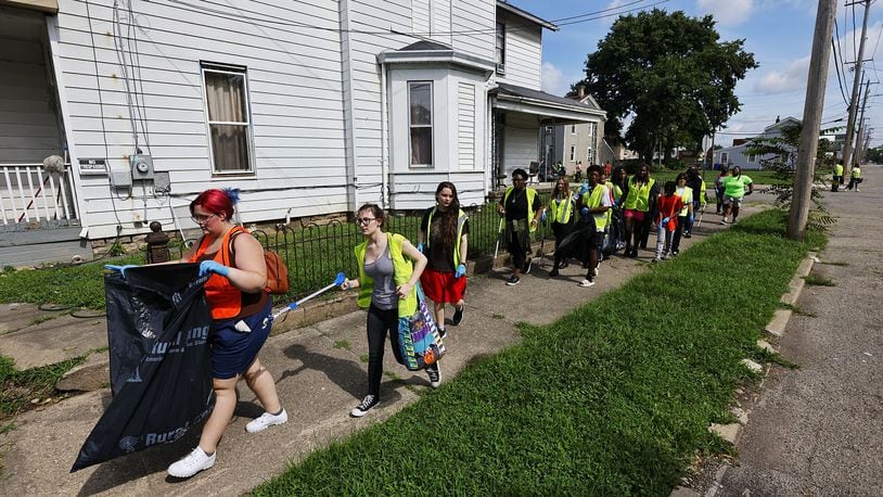 A group of nearly fifty people with HYPE Hamilton youth mentoring program, led by pastor Shaquila Mathews, cleaned up trash as a community service Thursday, July 28, 2022 in Hamilton. NICK GRAHAM/STAFF