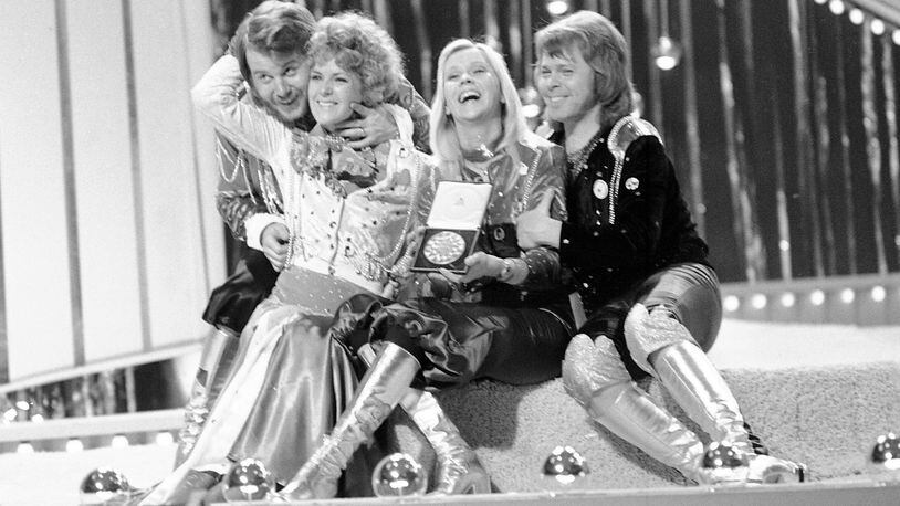 FILE - Swedish pop group ABBA celebrate winning the 1974 Eurovision Song Contest on stage at the Brighton Dome in England with their song Waterloo, April 6, 1974. The 68th Eurovision Song Contest is taking place in May in Malmö, Sweden. It will see acts from 37 countries vie for the continent’s pop crown. Founded in 1956, Eurovision is a feelgood extravaganza that strives to banish international strife and division. It’s known for songs that range from anthemic to extremely silly, often with elaborate costumes and spectacular staging. (AP Photo/Robert Dear, File)