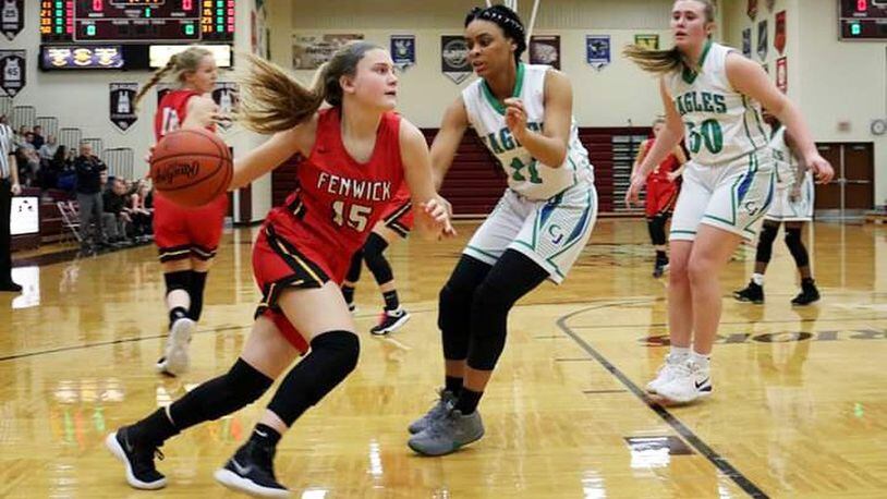 Fenwick’s Hannah Beckman (15) drives on Chaminade Julienne’s Teri McCann (11) on Saturday afternoon at Lebanon. Fenwick won the Division II sectional opener 38-35. CONTRIBUTED PHOTO BY TERRI ADAMS