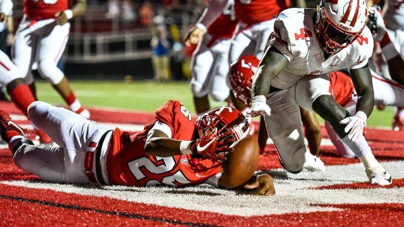 Lakota West’s David Afari (4) and Fairfield’s Corey Smith battle for a fumbled ball during a Sept. 14 game at Fairfield Stadium. The host Indians won 37-3. NICK GRAHAM/STAFF
