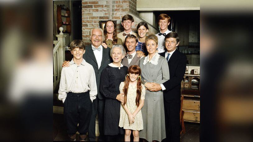 The Waltons photo from Jan. 1, 1977. From L to R: (back row) Mary McDonough, Jon Walmsley, Judy Norton, Eric Scott. Middle: Will Greer, Richard Thomas, Michael Learned, Ralph Waite. Bottom : David Harper, Ellen Corby, and Kami Cotler.