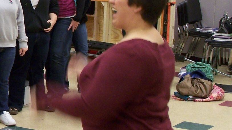 Lebanon High School vocal teacher Kristi Ross (right) conducts rehearsals for the school’s Cantare Choir in this file photo.