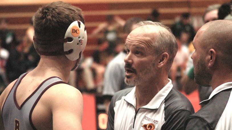 Ross coach Rich Dunn talks things over with Logan Iams during their Division II state duals match against Akron St. Vincent-St. Mary last season at St. John Arena in Columbus. COX MEDIA FILE PHOTO