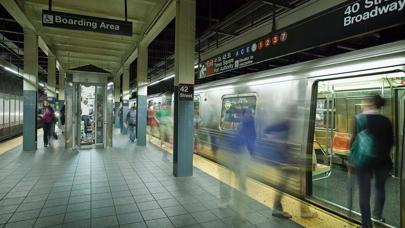 Time-lapse image of a Times Square subway platform in New York. (Stock photo)