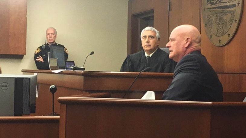Miami Twp. Detective Todd Comer testifies Monday in a hearing to determine if a 17-year-old accused of shooting to death DoubleTree employee Jayren Graham should be tried as an adult. NICK BLIZZARD/STAFF