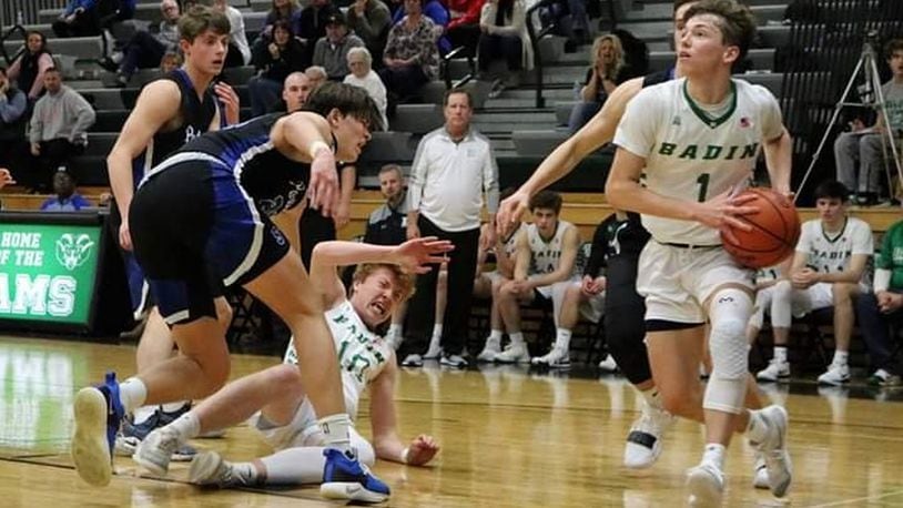 Badin’s Joseph Walsh (1) drives to the basket as teammate Zach Switzer (10) gets knocked to the ground during Tuesday night’s game against Springboro at Mulcahey Gym in Hamilton. Badin won 55-47. CONTRIBUTED PHOTO BY TERRI ADAMS
