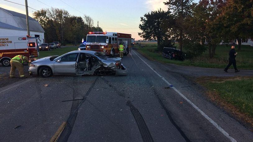 A distracted driver went left of center and struck two vehicles last month. The driver told an OSP trooper she looked down to change the radio before the crash.