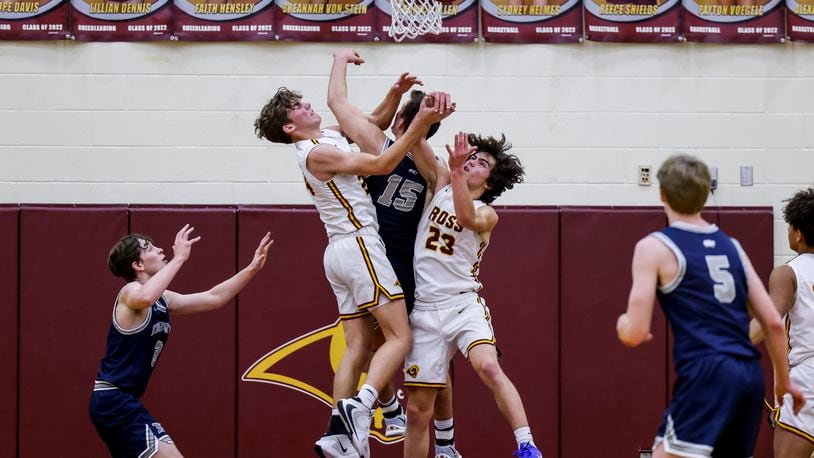 Ross guard Aidan Brown (24), Edgewood guard Caleb Allen (15) and Ross guard David DeSalvo Perez (23) battle for a rebound during their basketball game Friday, Jan. 7, 2022 at Ross High School. Edgewood won 61-56 in overtime. NICK GRAHAM / STAFF