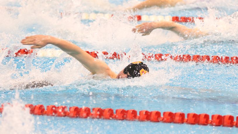 Fenwick High School sophomore Adam Chaney, shown in action earlier this season, captured Division II state championships in the 50- and 100-yard freestyle events this weekend at C.T. Branin Natatorium in Canton. PHOTO COURTESY OF FENWICK HIGH SCHOOL